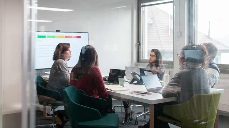 Five Frontiers team members in a meeting